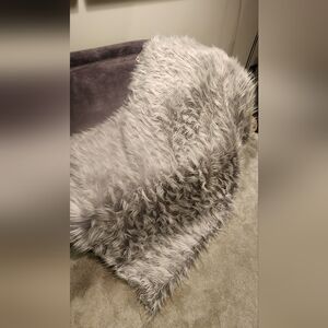 Like new!  Beautiful soft throw blanket in light grey
